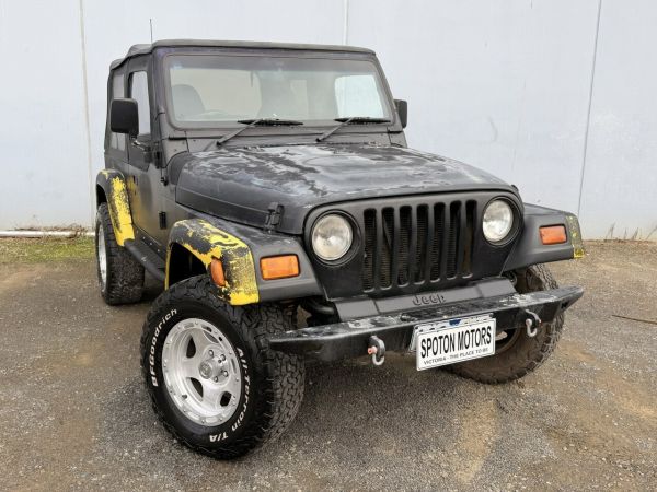 1997 Jeep Wrangler TJ Sport (4x4) Black 3 Speed Automatic 4x4 Softtop image