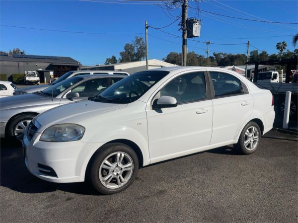 2011 HOLDEN BARINA 4D SEDAN TK MY11